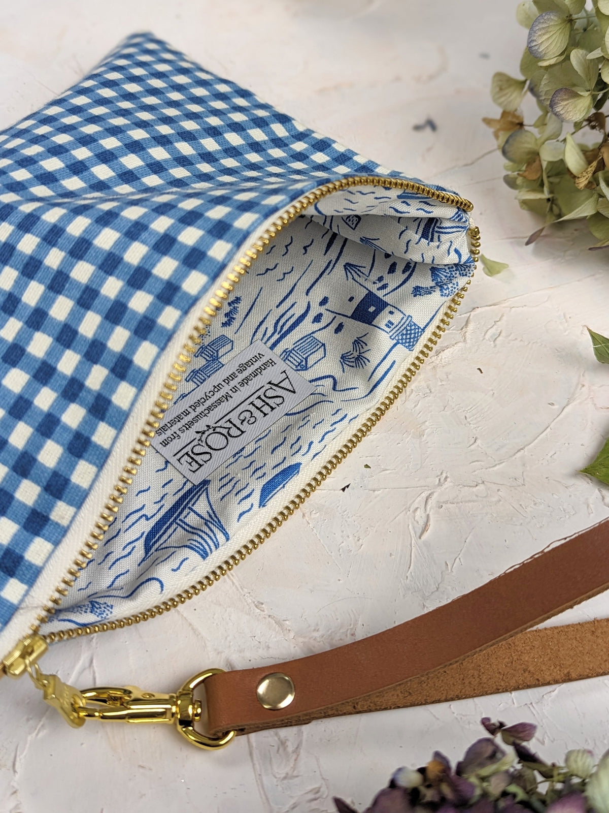 Magenta summer picnic wristlet purse by Ash & Rose with a compact design and wrist strap for easy carrying.