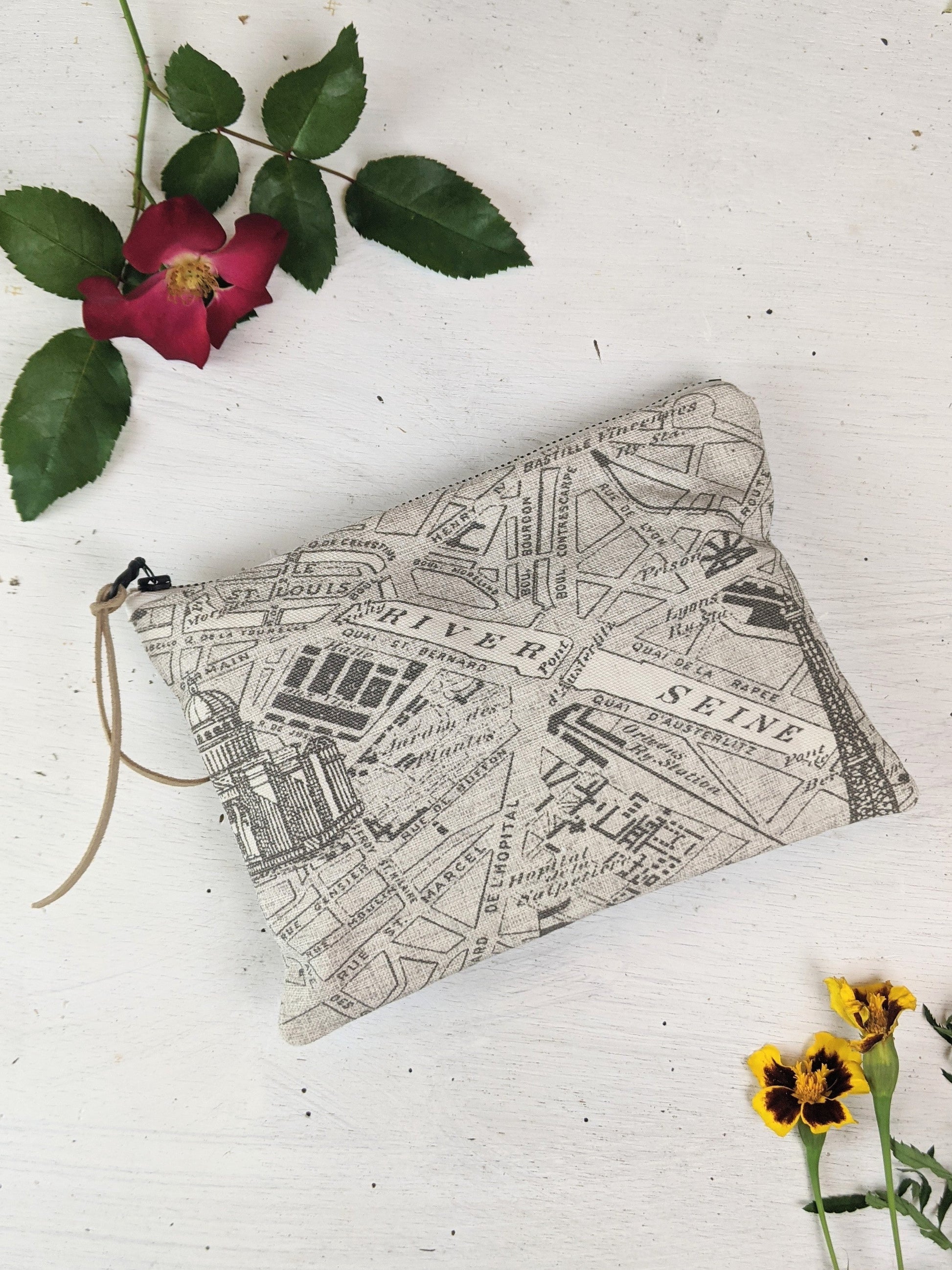 Ash & Rose Paris Map purse featuring a detailed map design, compact and stylish accessory for carrying essentials.