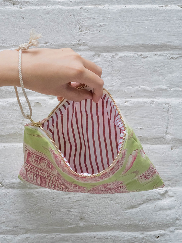 Pink Ash & Rose Nantucket purse with leather straps and compact design, showcasing its stylish and functional exterior.
