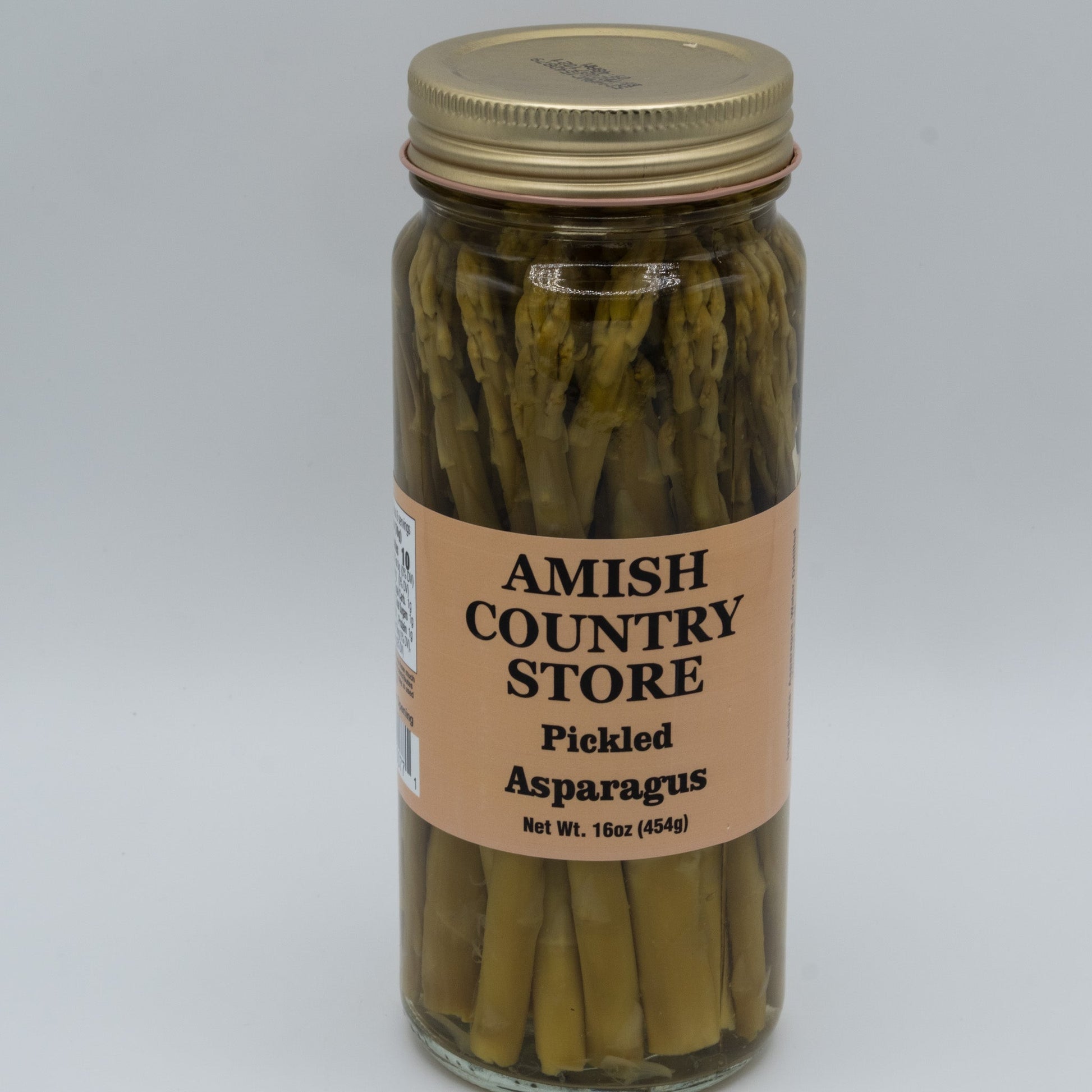 Jar of Amish Country Store pickled asparagus in a glass jar, showcasing bright green asparagus spears submerged in pickling liquid.