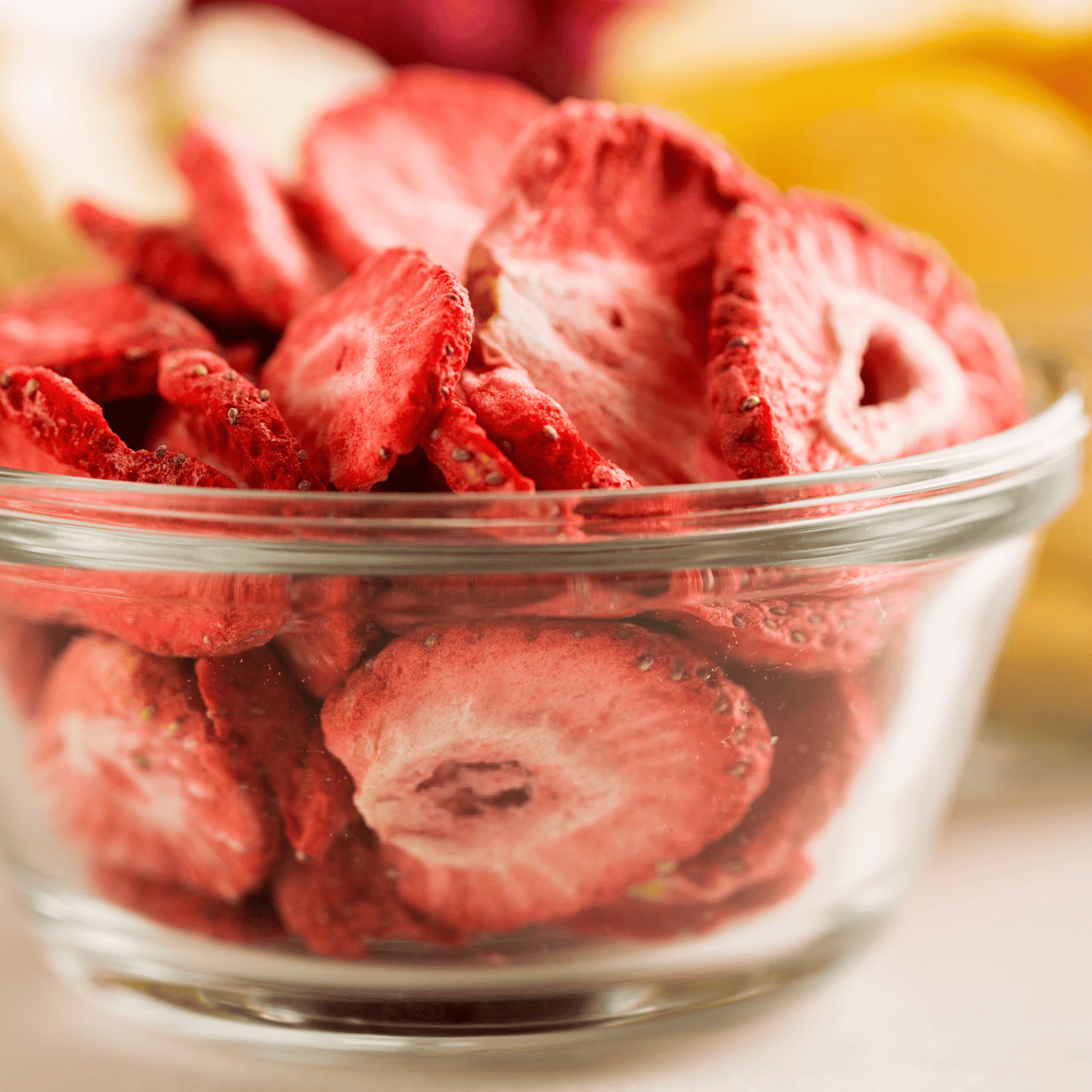Freeze dried sliced strawberries in a family size pouch by Augason Farms, showing the colorful strawberry slices inside.
