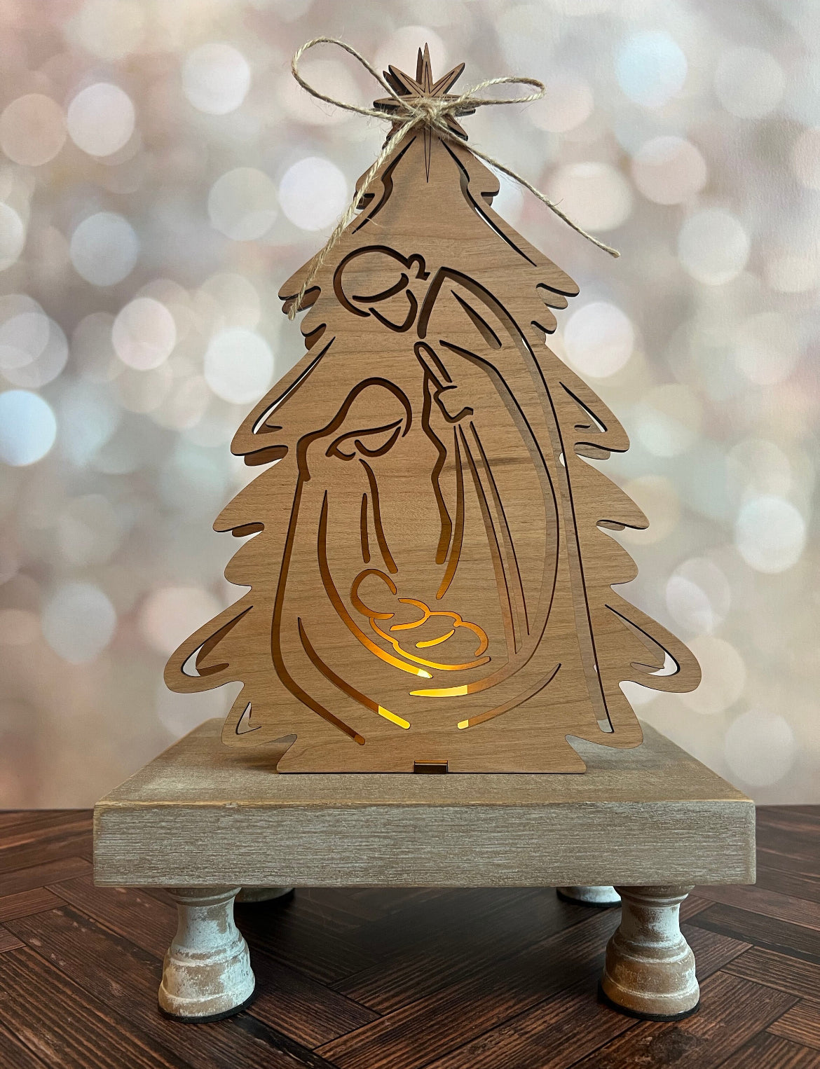 Laser-engraved Nativity Scene with Votive Candle by AVEL Woodworking, detailed wood depiction with lit candle centerpiece.