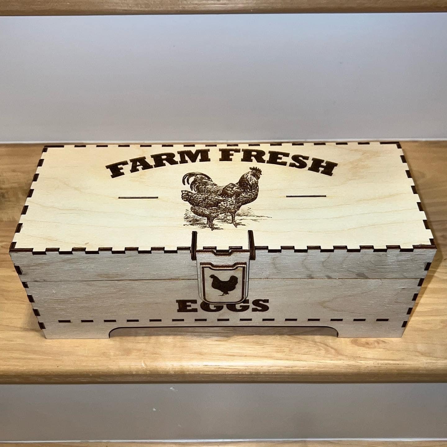 Laser-engraved wooden egg box by AVEL Woodworking with detailed chicken design and individual compartments for eggs