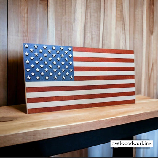 Mini stained American flag wall decor by AVEL Woodworking, showcasing a detailed, handcrafted wooden flag with vibrant colors.