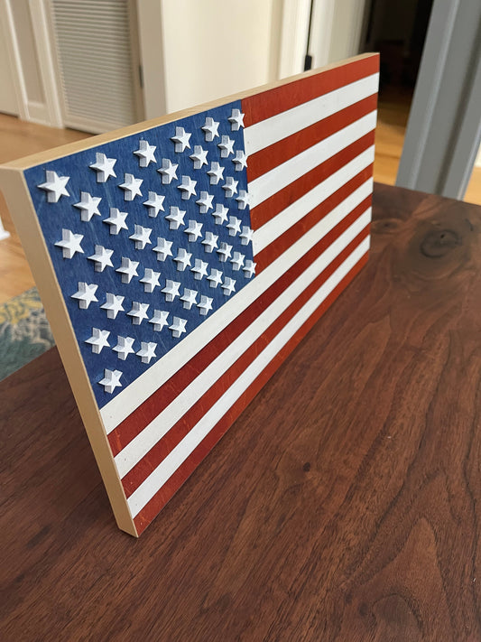 Mini stained American flag wall decor by AVEL Woodworking, featuring a detailed wooden American flag design.