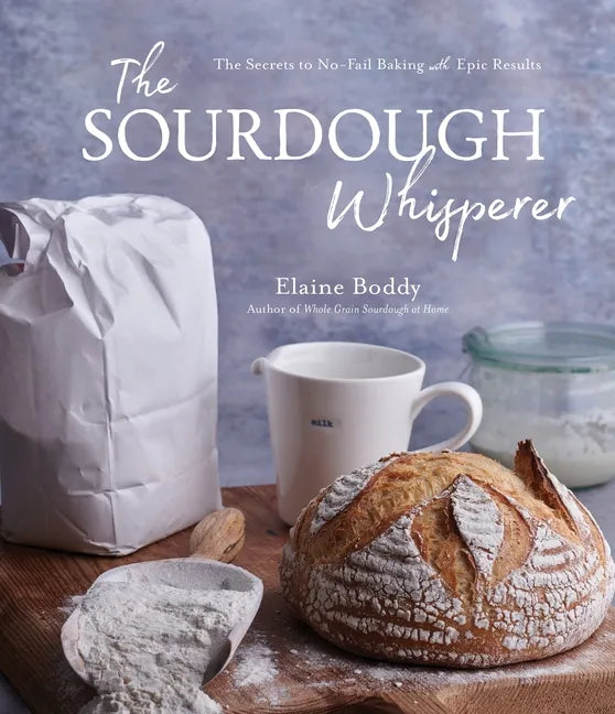 Paperback book titled "The Sourdough Whisperer" by splitShops, featuring a cover with sourdough bread and baking tools.