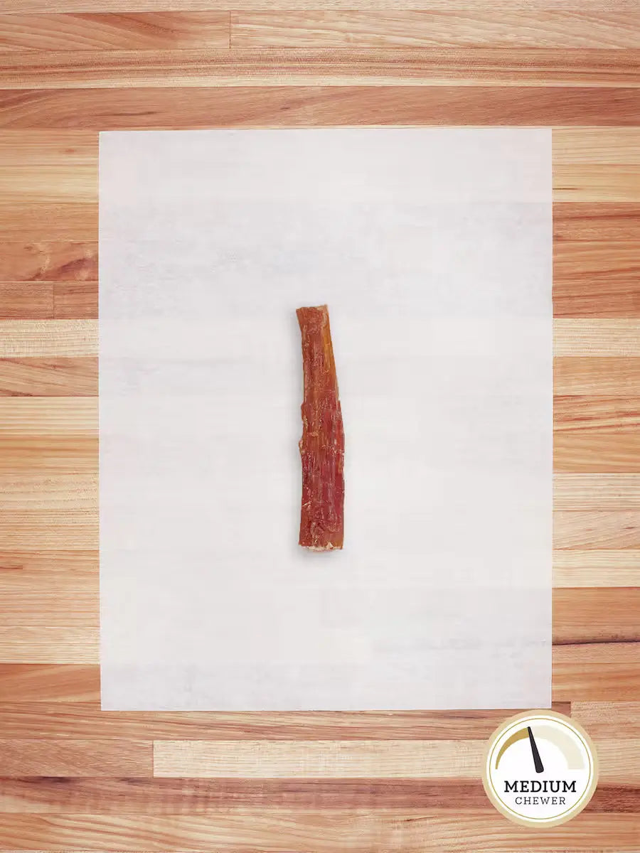 Farm Hounds grass-fed beef tendons chews for dogs, showing the small backstrap cut on a clean surface.