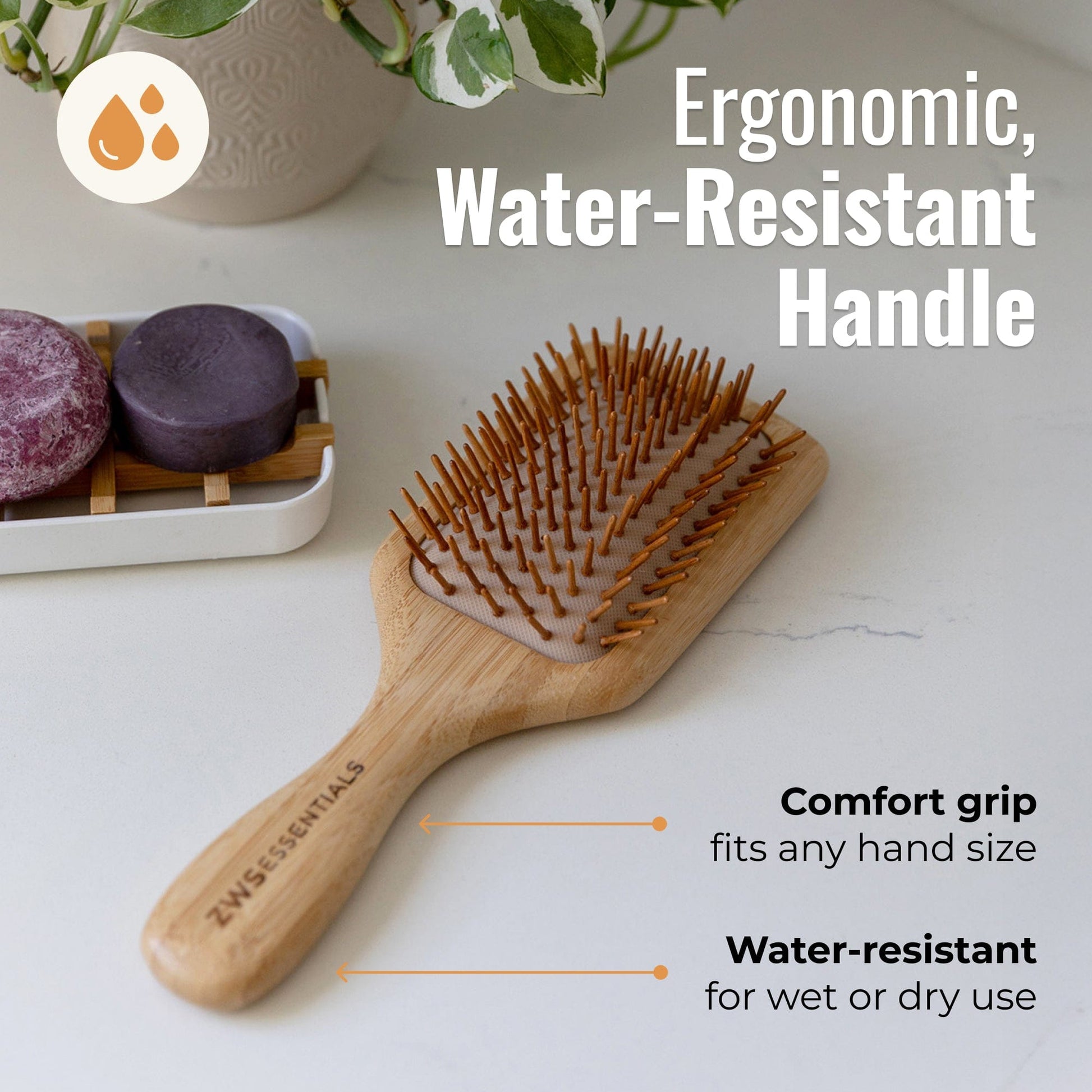 Bamboo hair brush from ZeroWasteStore.com with wooden bristles for gentle scalp massage and detangling hair.