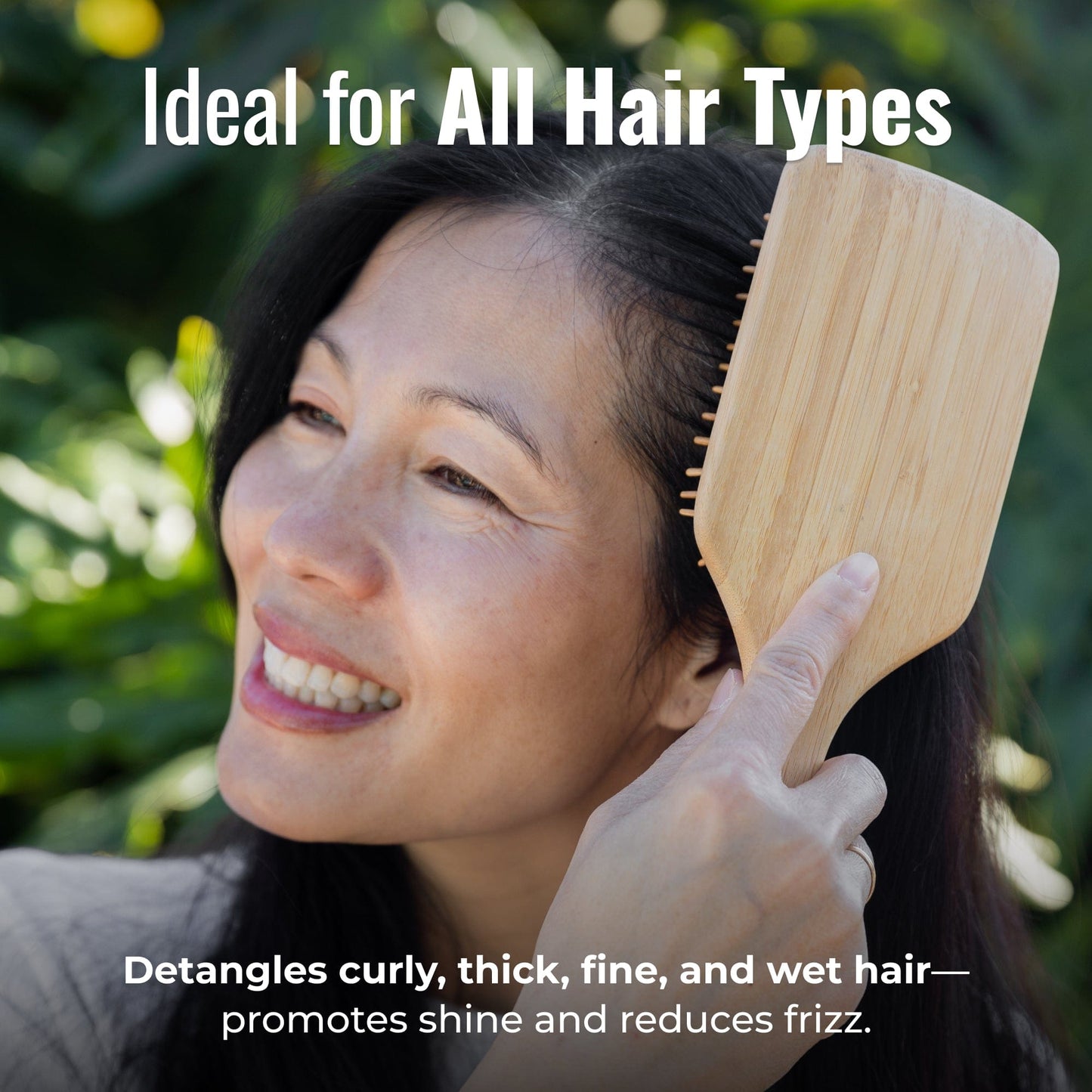 Bamboo hair brush from ZeroWasteStore.com with wooden bristles, eco-friendly design, suitable for detangling and gentle hair care.