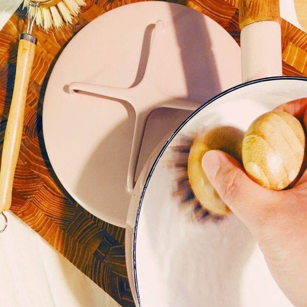 Tilley + Me sustainable bamboo pot scrubber with palm fiber bristles for effective cleaning and eco-friendly dishwashing.