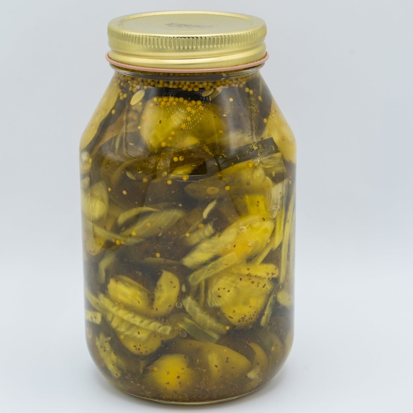 Canned Amish Country Store Bread & Butter Pickles in a 32 oz jar, showing sliced pickles with bright, tangy flavor visible inside the jar.