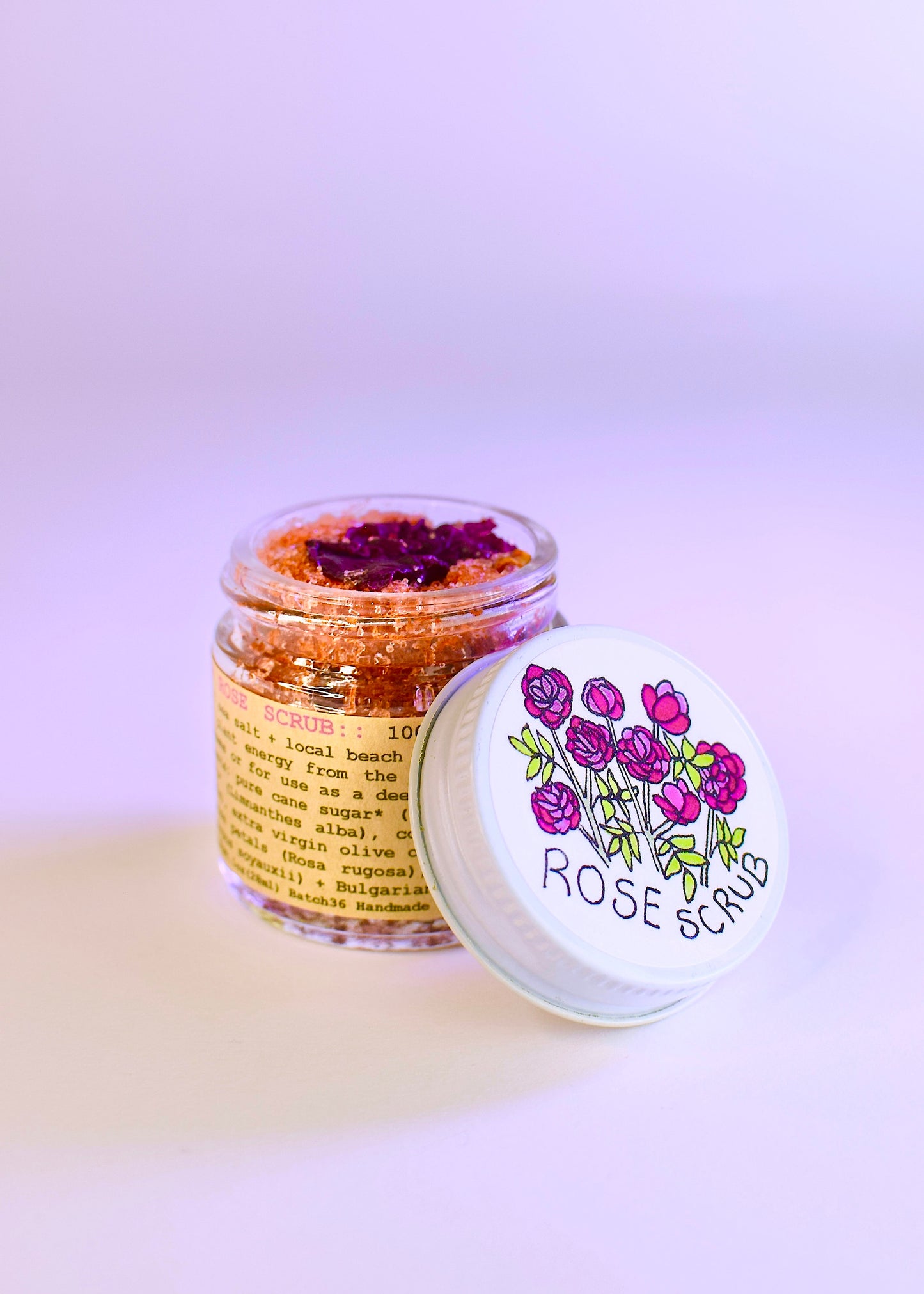 Plant Makeup Beach Rose Scrub with natural rose exfoliants and creamy texture, shown in a close-up of the product container.