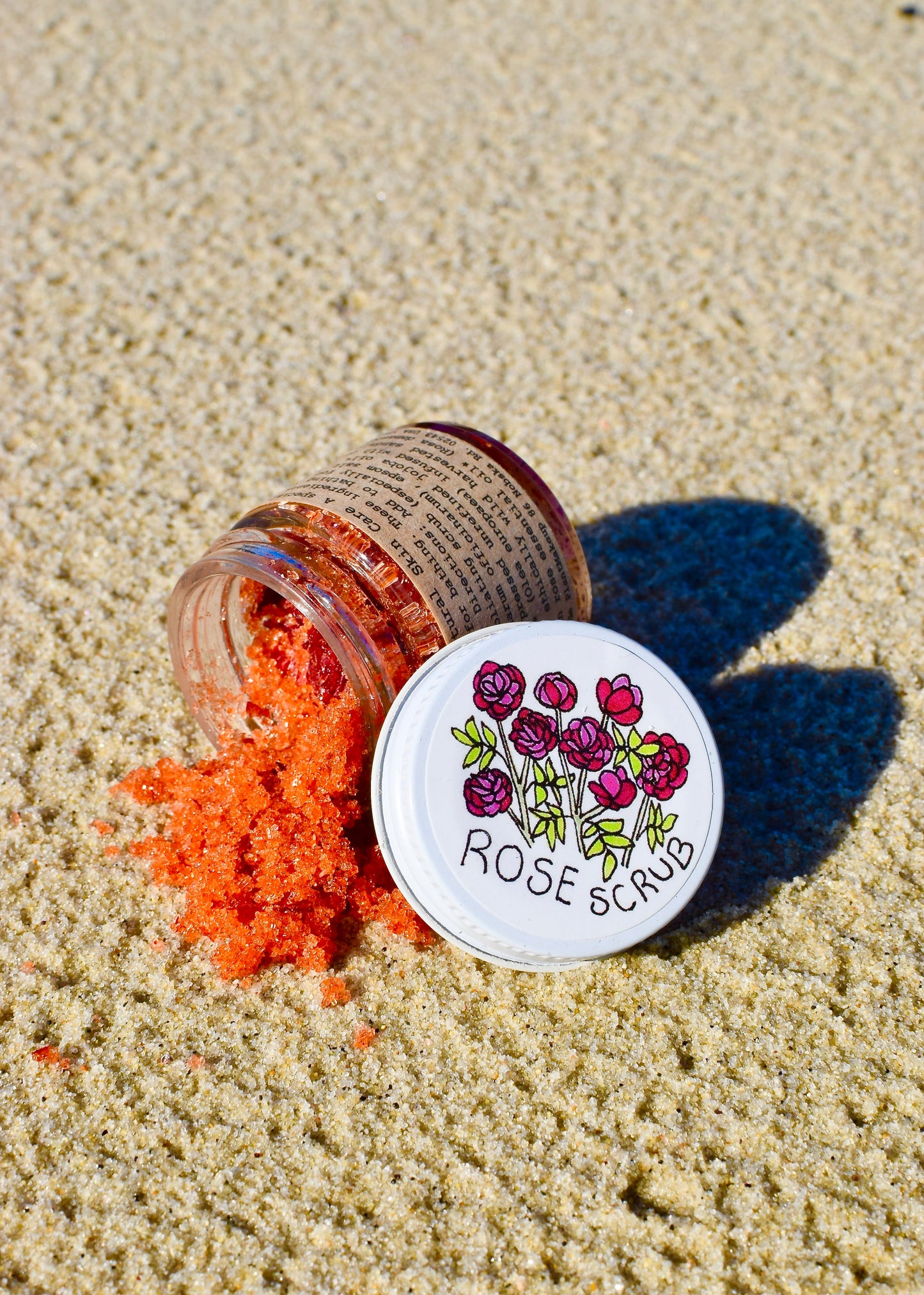 Plant Makeup Beach Rose Scrub in a jar with natural rose exfoliating grains and a soft pink color, perfect for skincare.