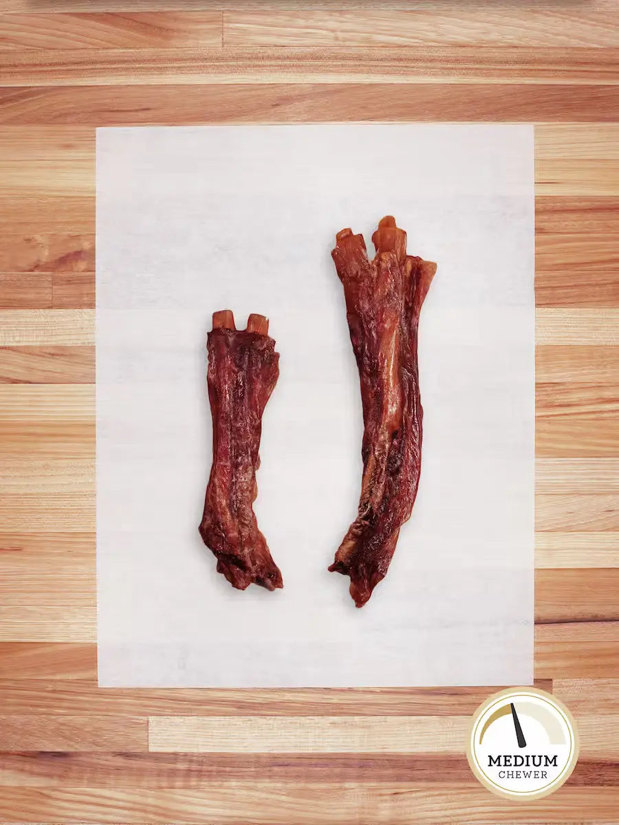 Farm Hounds grass-fed beef tendons chews, natural dog treats with visible beef tendons and a rustic background.