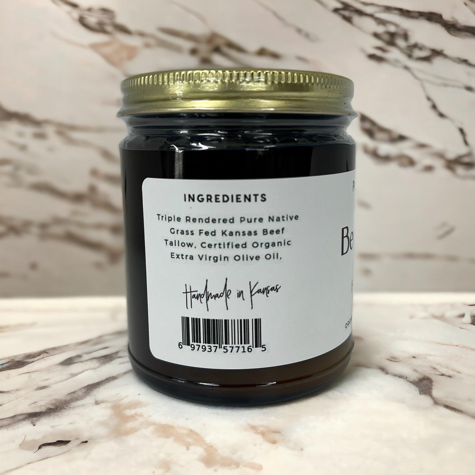 A jar of Prairie Fire Tallow, Candles, and Lavender Beef Tallow Balm (8 oz) sits on marble. The label notes its made in the USA from organic grass-fed tallow and extra virgin olive oil for moisturizing skin care. A barcode is visible.