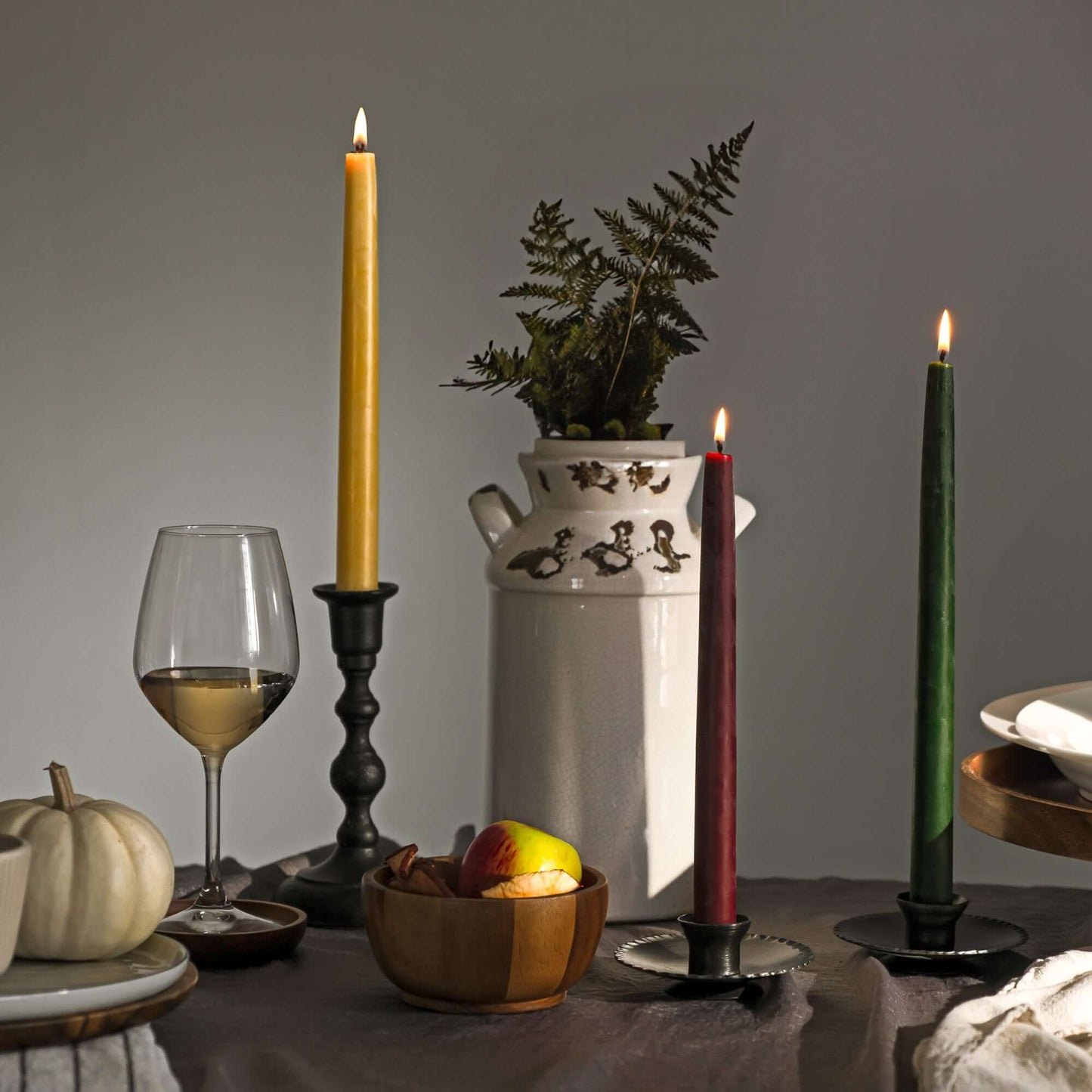 Pair of Bluecorn Candles hand-dipped beeswax taper candles in a bulk 4-pair bundle, with warm honey-colored wax and natural finish.
