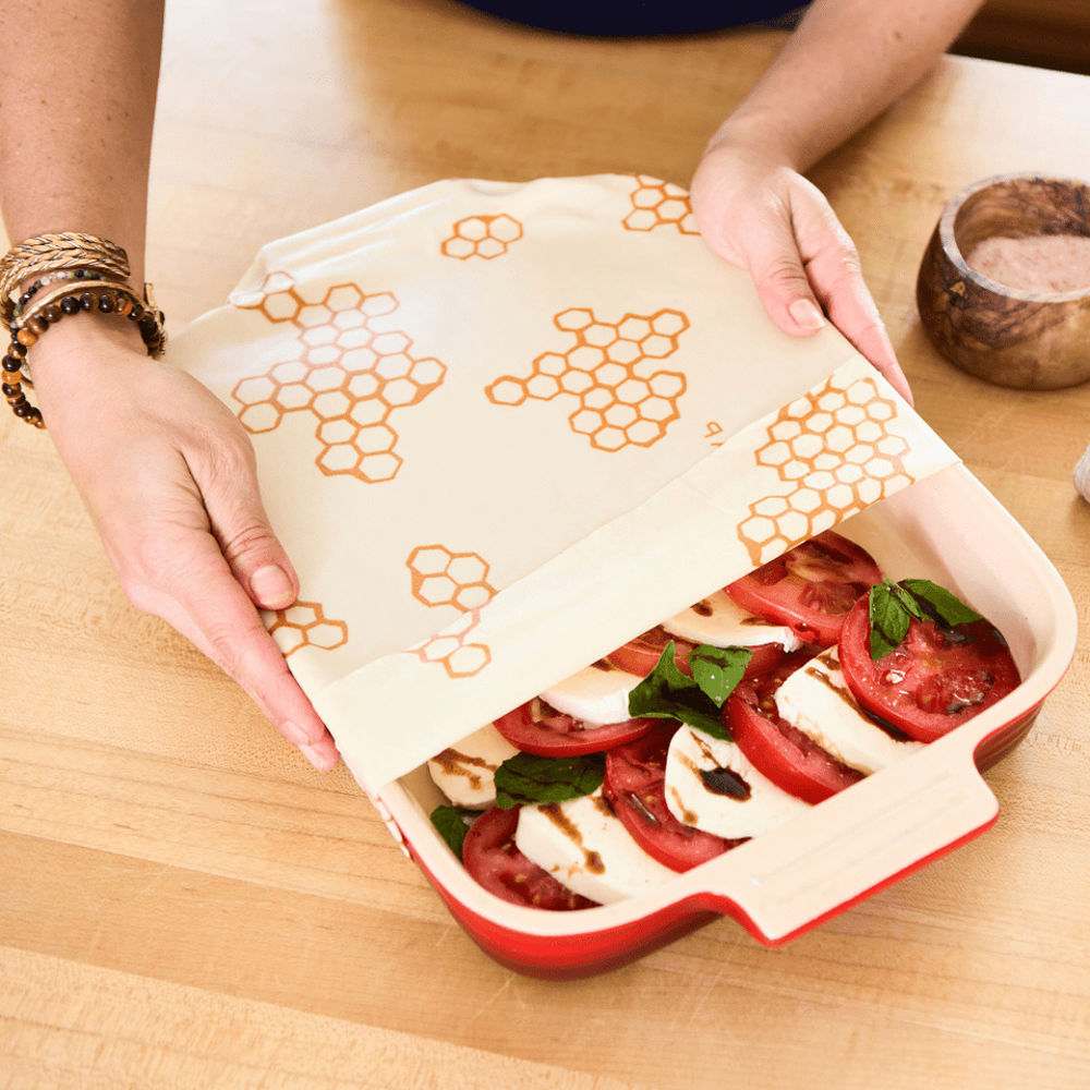 Reusable beeswax food wraps by Tilley + Me, showcasing organic, colorful, patterned wraps for sustainable food storage.