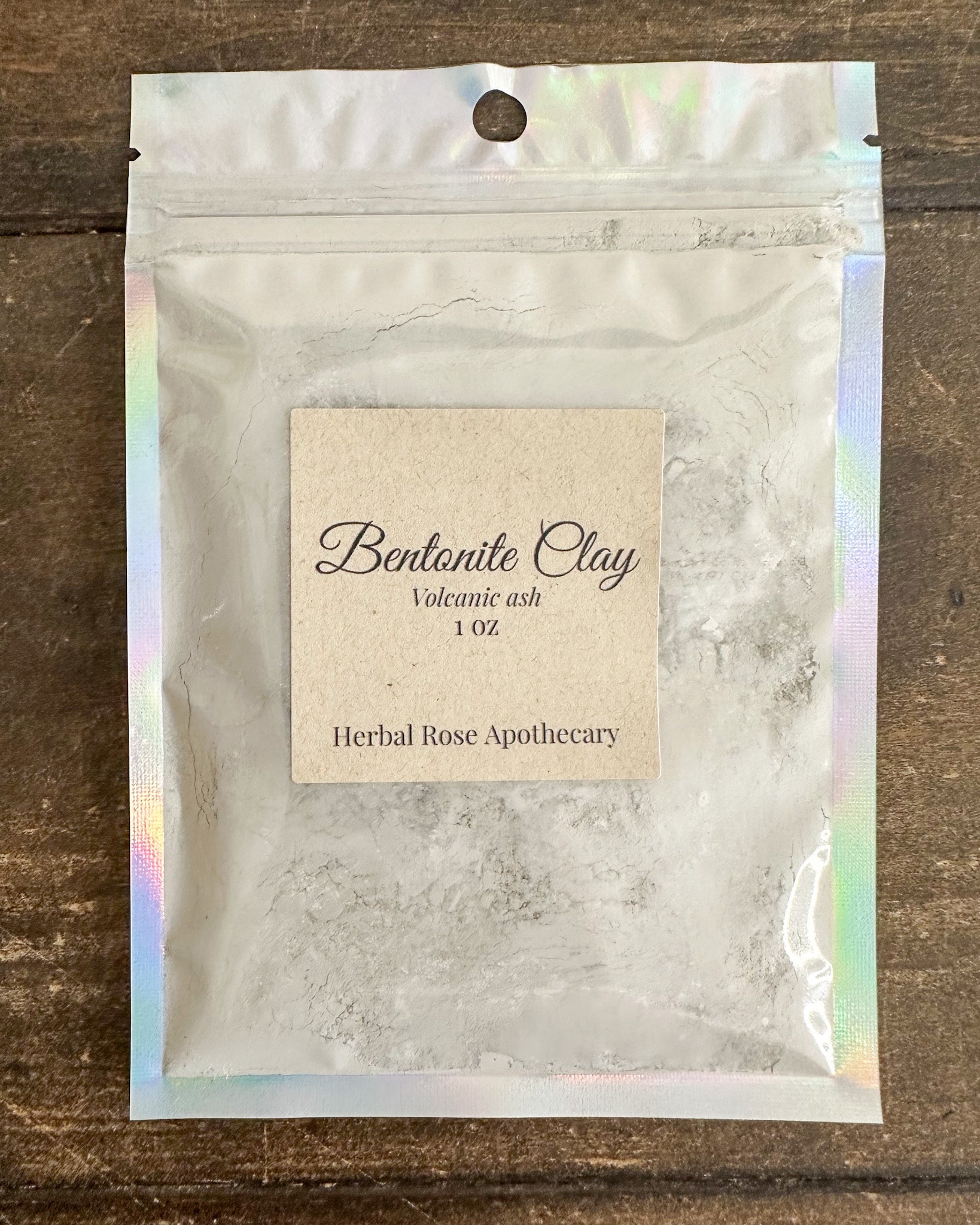 Bentonite clay powder in a 1 oz container from Herbal Rose Apothecary, showing the powder and packaging.