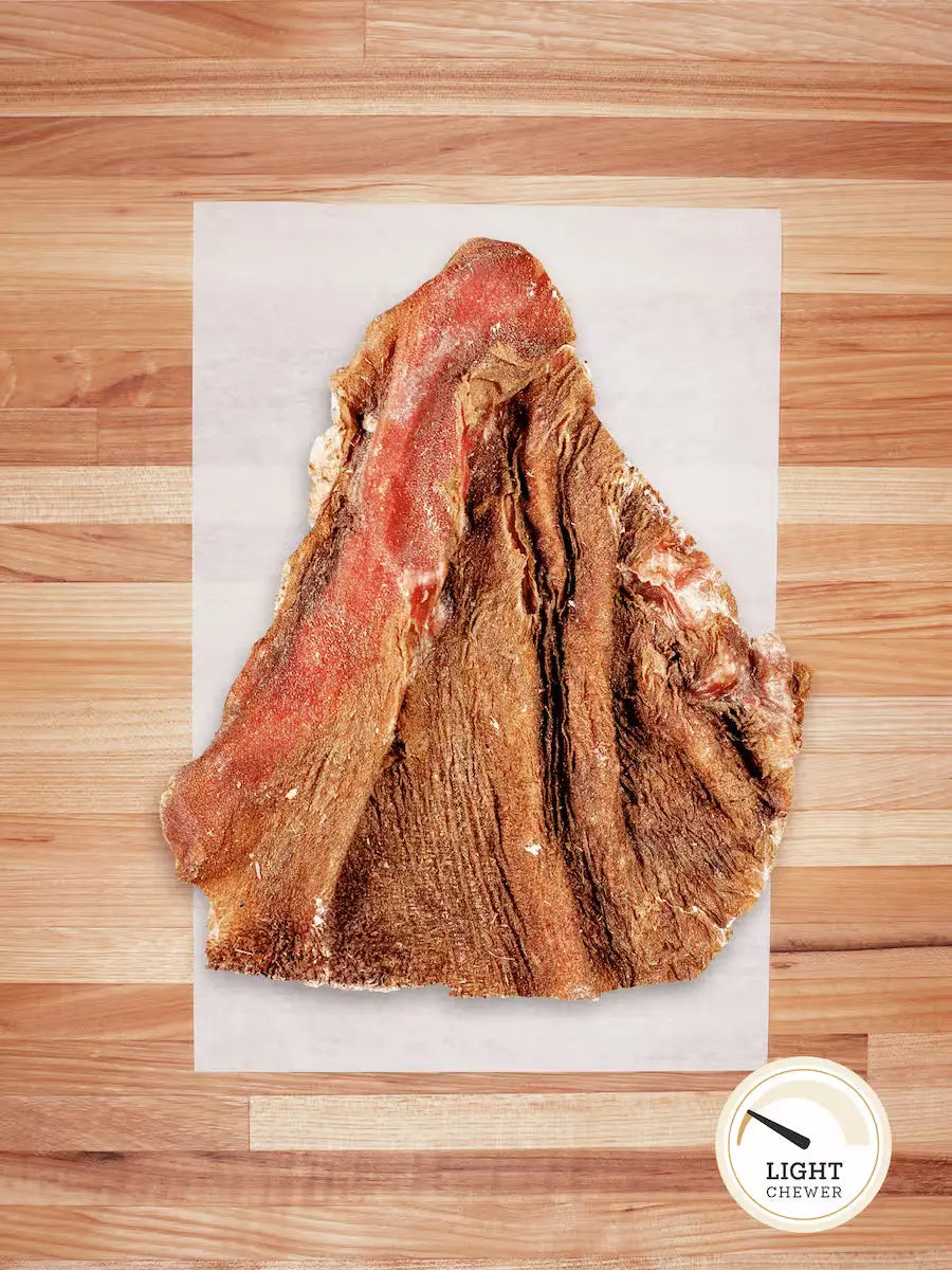Dehydrated green bison tripe chew for dogs from Farm Hounds, showing textured, dried tripe pieces in the image.