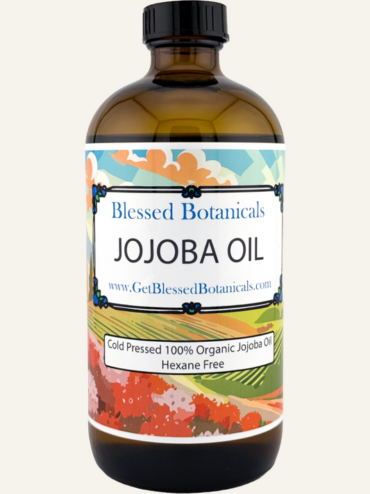 Cold-pressed organic jojoba oil bottle from Blessed Botanicals, showing clear liquid in a dark glass container.