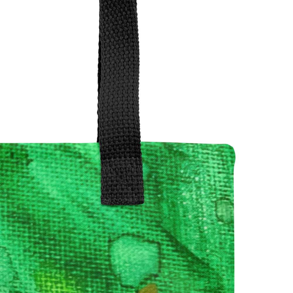Fabric tote bag featuring an abstract green landscape with vibrant lime and teal accents and a black woven handle