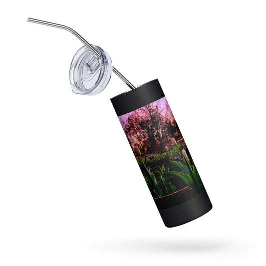 Stainless steel tumbler featuring a sunset garden scene with vibrant pink hues, lush green tulips, and silhouetted trees at dusk
