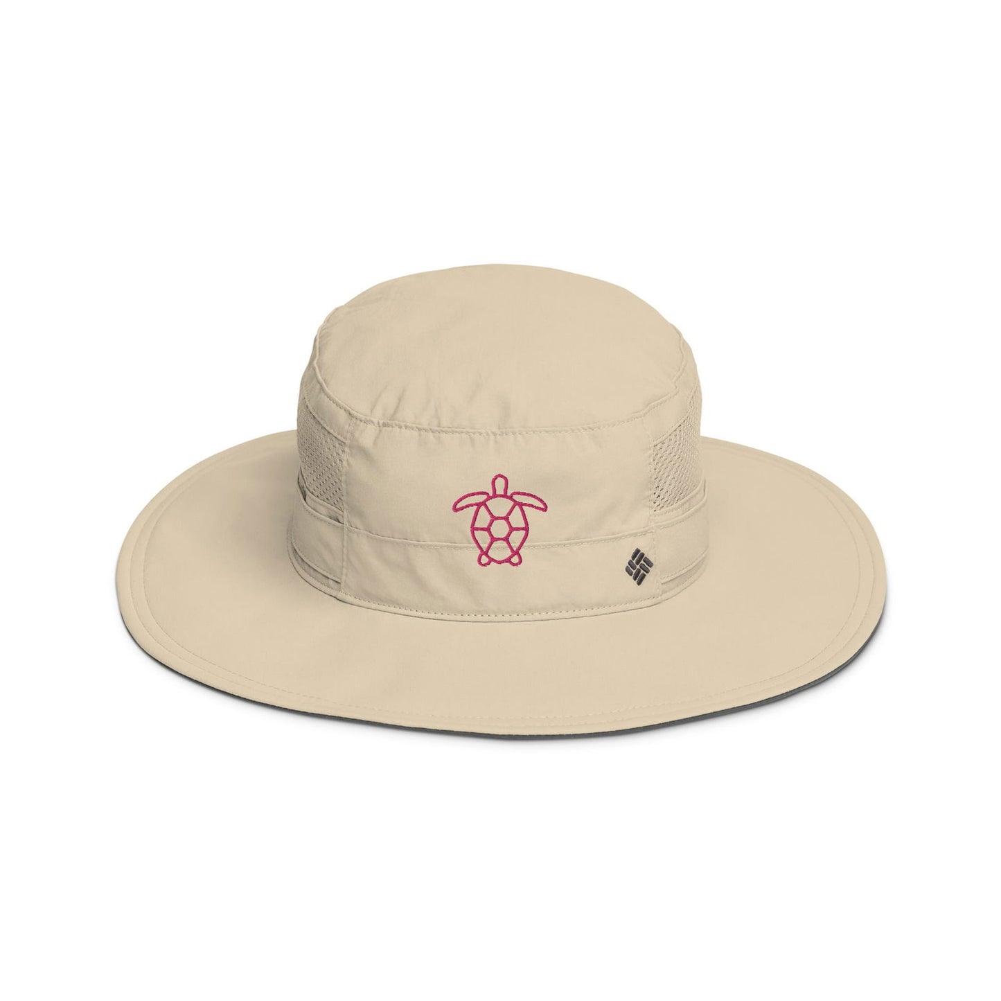 Beige Columbia sun hat featuring a pink embroidered sea turtle design and a dark gray underbrim
