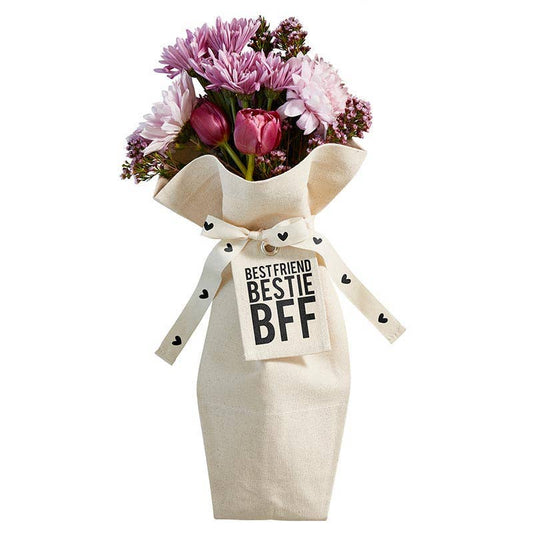 The Bouquet Bag - BFF by Blessings Grow Meadows Merch & More features pink and purple flowers in a reusable canvas bag, tied with a white ribbon and a BEST FRIEND BESTIE BFF tag in bold black letters.