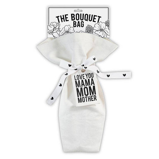 The Bouquet Bag - Mama by Blessings Grow Meadows Merch & More is a white reusable canvas flower bag with a black-and-white floral design, ribbon tie, and tag reading LOVE YOU MAMA MOM MOTHER—an ideal gift for mama.