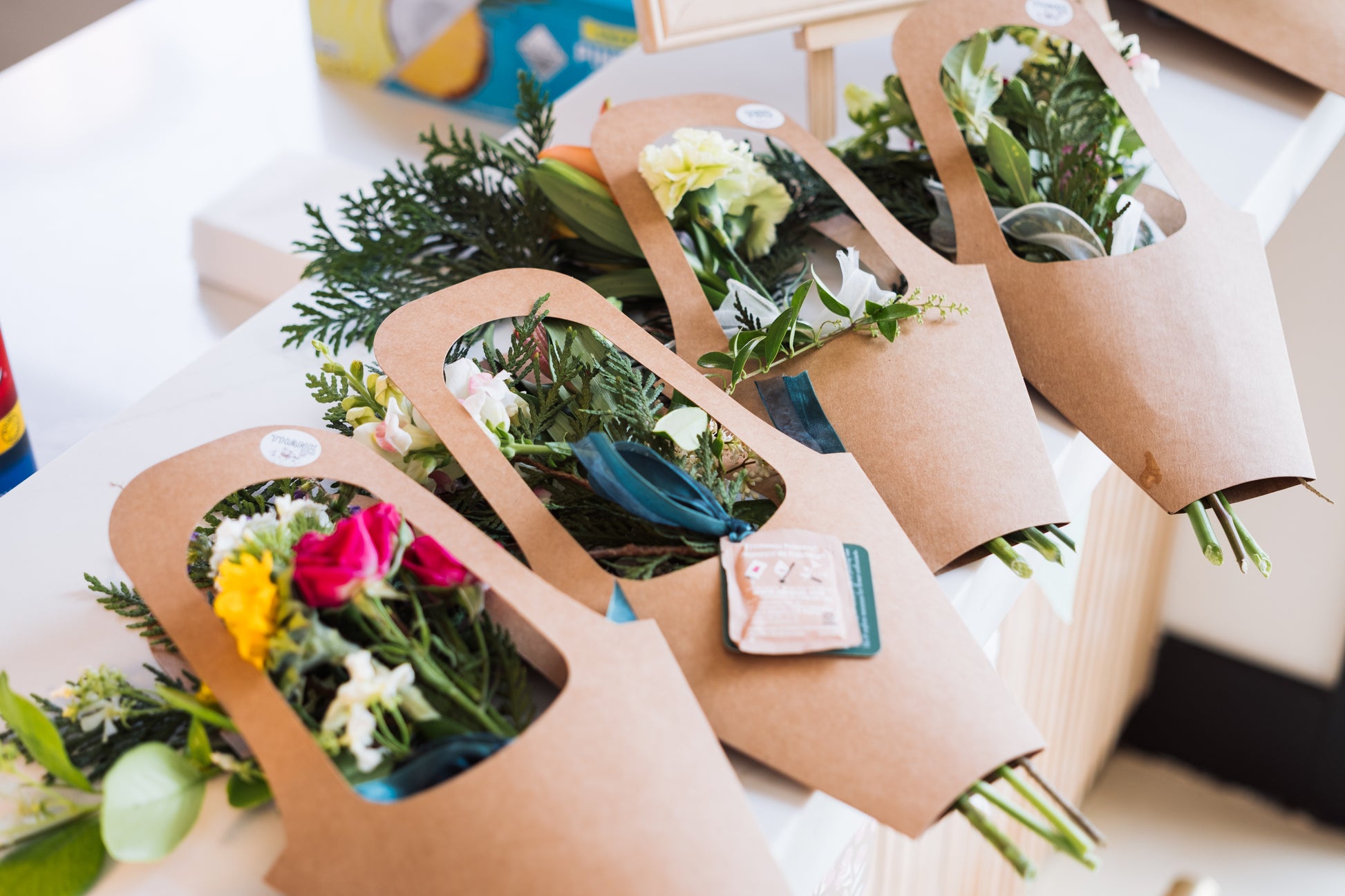 Five small bouquets in a colorful mix are displayed in buckets on the RENTAL: Flower Display Stand from Blessings Grow Meadows Merch & More—ideal for weddings or events. Pick-up available in Metter, GA.