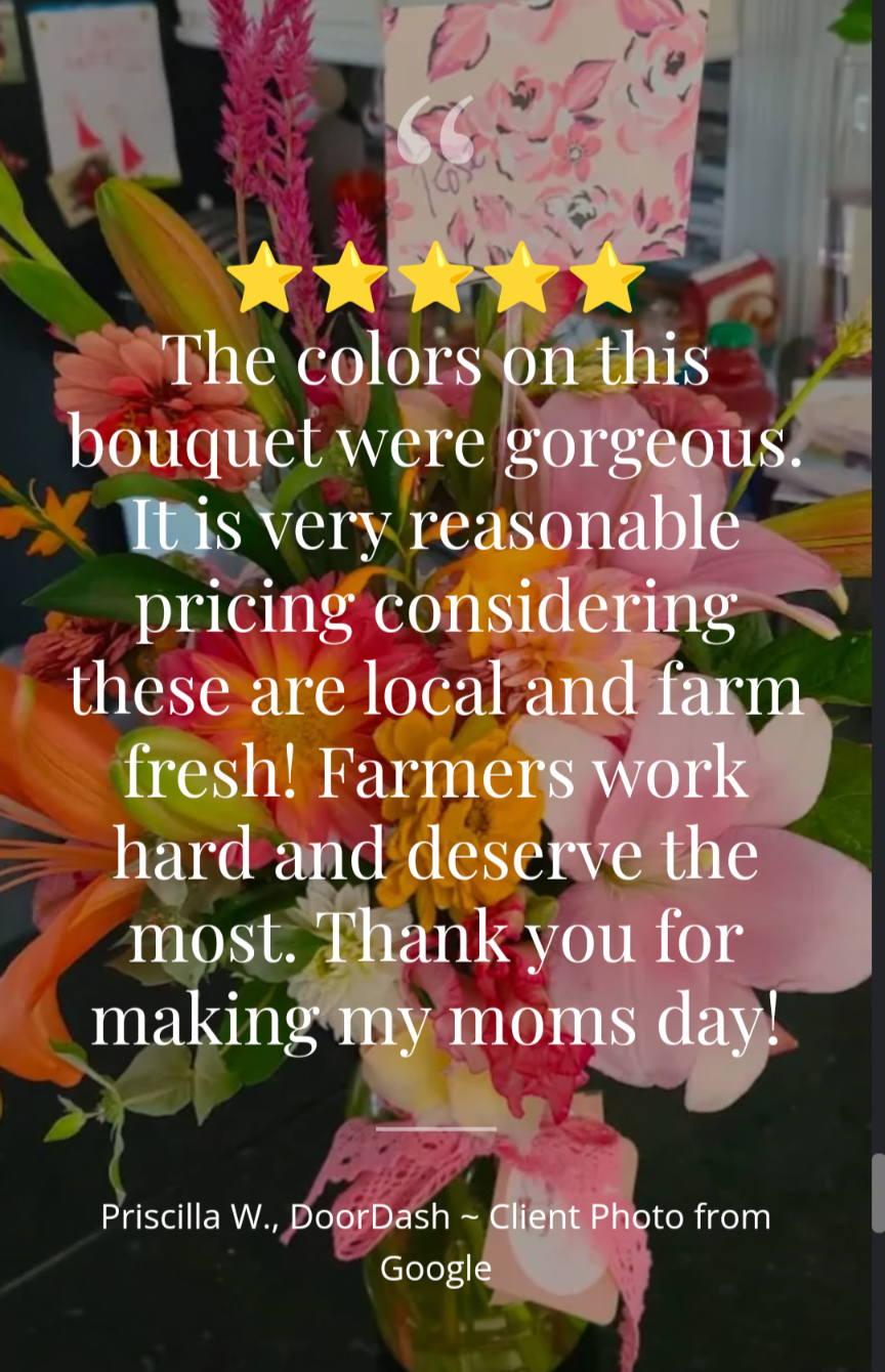 A vibrant background of pink, orange, and yellow flowers frames a five-star review for Blessings Grow Meadows Merch & More’s Custom Deluxe Arrangement, highlighting its quality, fair prices, and locally grown, farm-to-vase flowers.