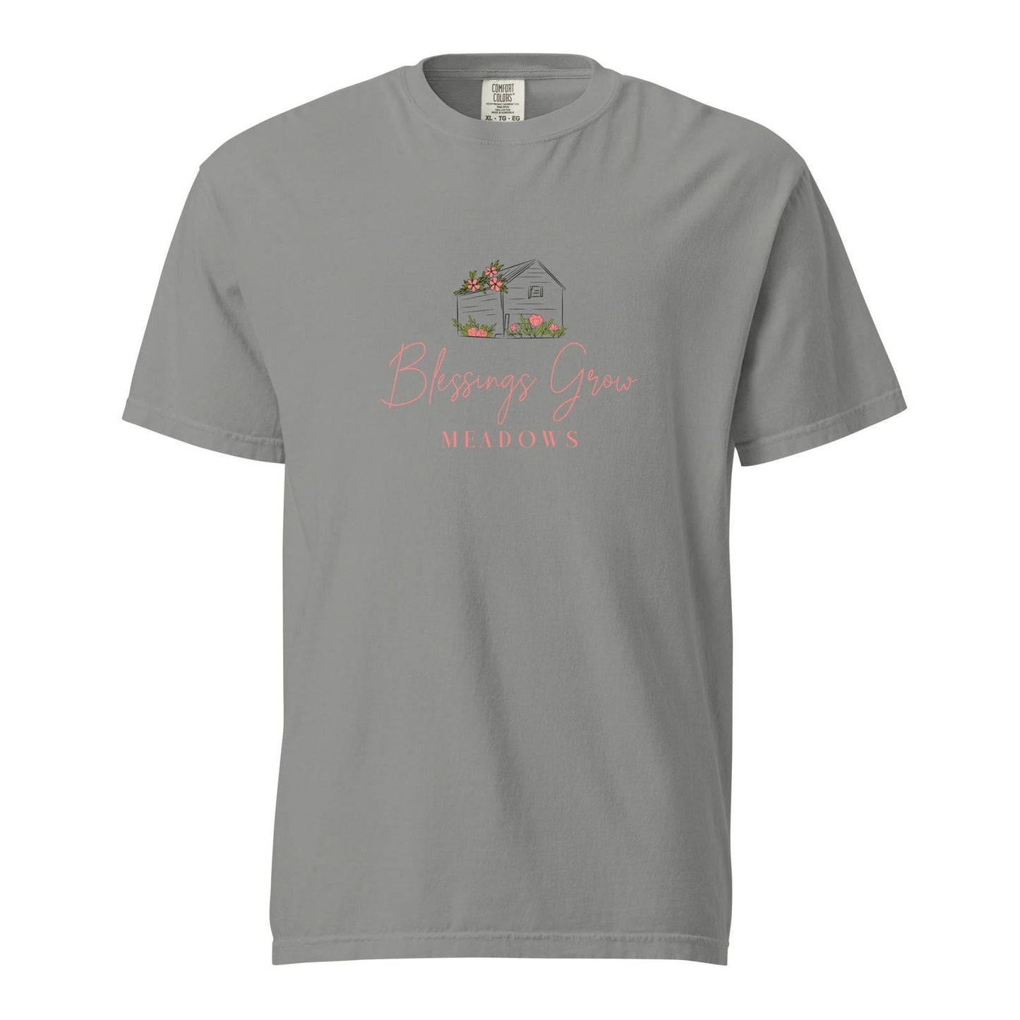 Comfort Colors gray t-shirt featuring Blessings Grow Meadows design with a charming house, pink flowers, and lush green grass
