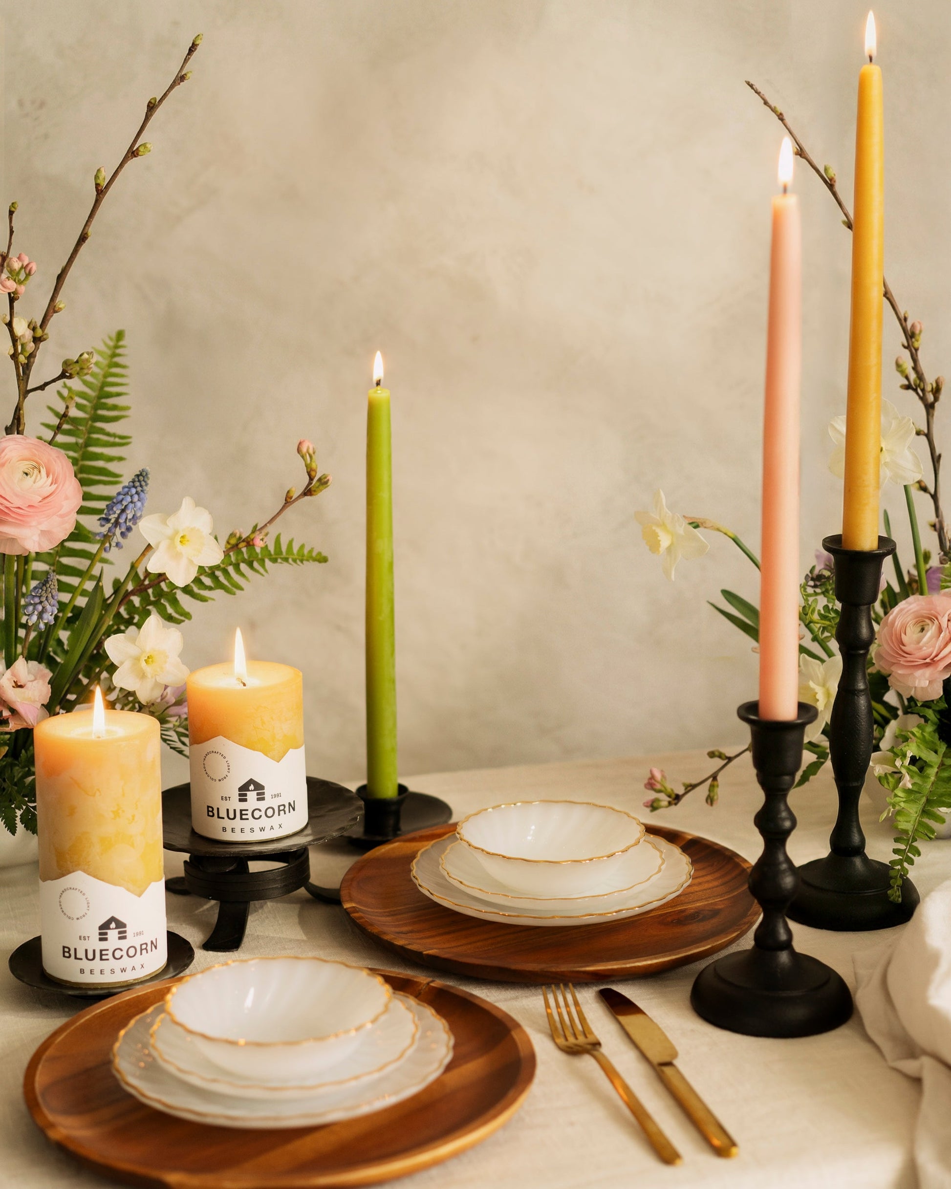 Pair of Bluecorn Candles hand-dipped beeswax taper candles in a spring bundle, featuring natural yellow beeswax color.