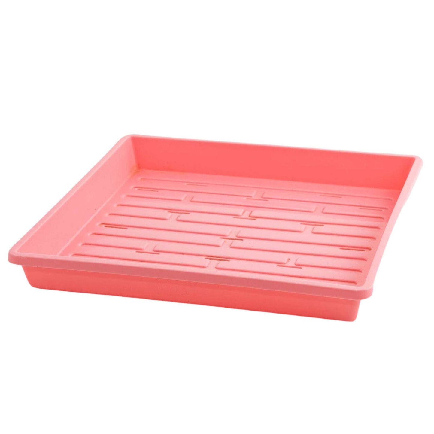 Plastic seedling tray showing a pale pink color with a gridded bottom and raised edges

