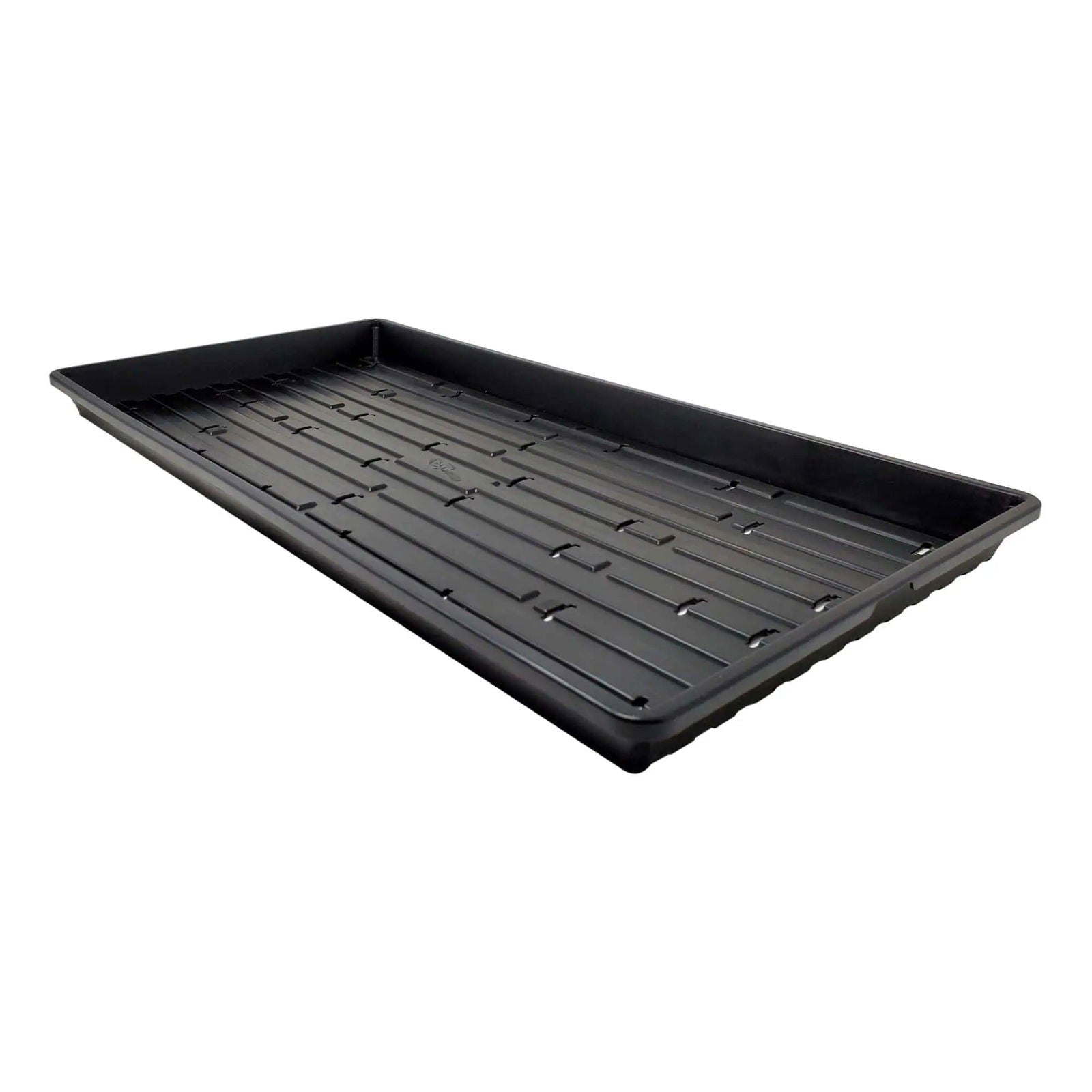 Plastic seedling tray showing parallel drainage channels and small drainage holes a dark matte black rectangular shape ideal for starting seeds
