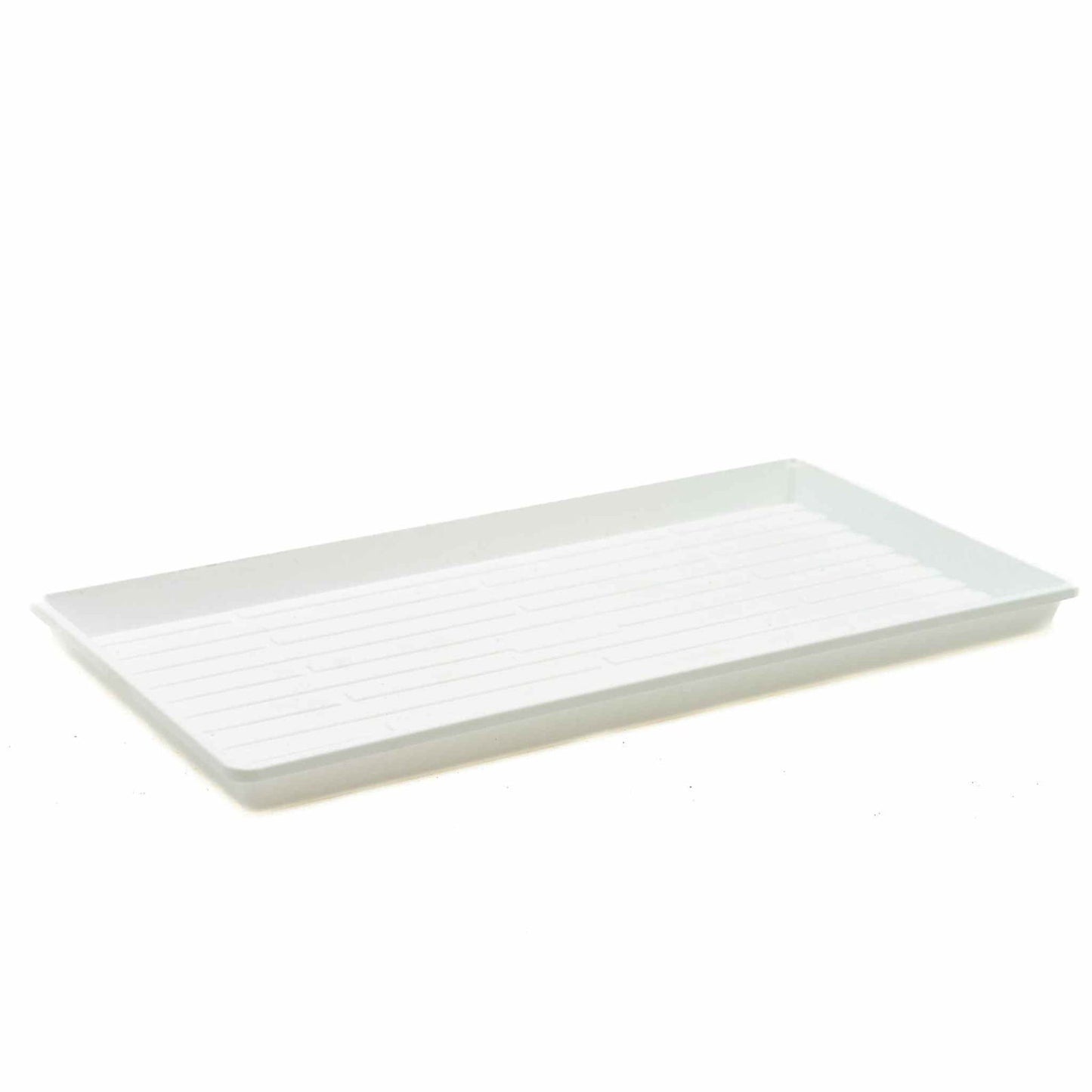 Plastic rectangular tray with parallel ridges showing subtle variations in texture and a slightly off-white hue against a stark white background
