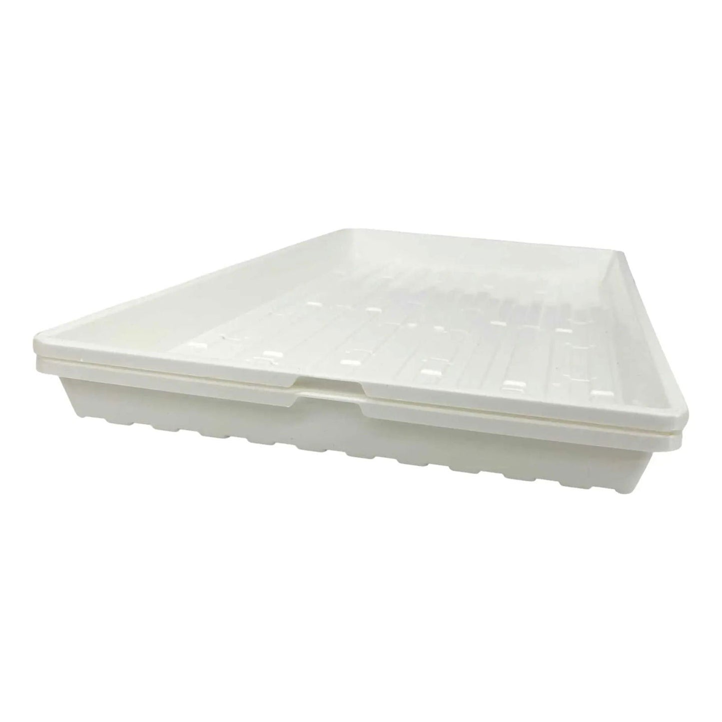Plastic seedling tray featuring a ribbed surface and a slightly off-white hue showcasing a double-layered design with indented sections for drainage and aeration
