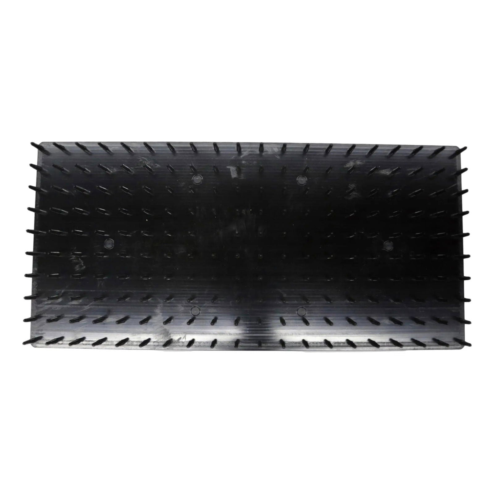 The Bootstrap Farmer Plug Popper for Cell Trays is a rectangular, black plastic tray seen from above, with rows of vertical slits and raised bumps lining the inner walls and base.