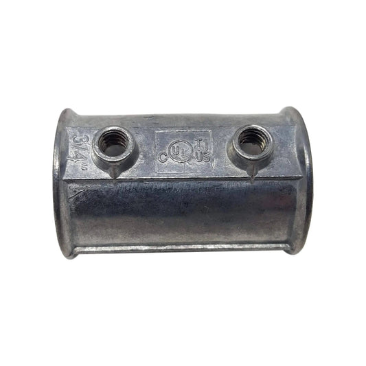 The Bootstrap Farmer Die Cast EMT Coupling - 3/4 is a silver metal cylindrical electrical conduit connector made of zinc-plated steel, with two threaded top openings. It features engraved markings, including a logo and dimensions, and boasts a smooth, shiny finish for seamless integration.