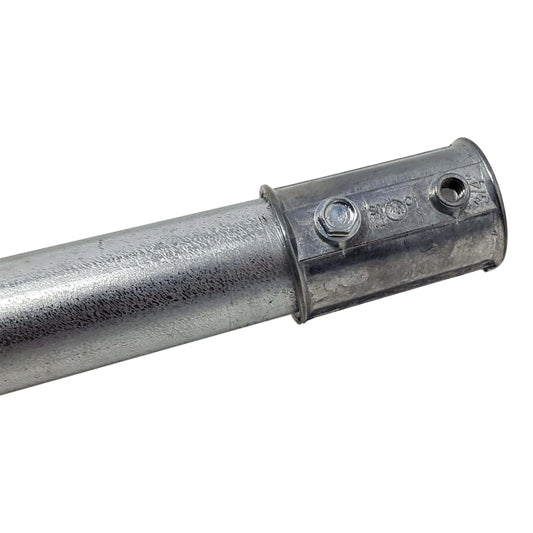 Close-up of a zinc-plated steel pipe with a 3/4 inch Die Cast EMT Coupling by Bootstrap Farmer, secured with a bolt and nut. The pipe is textured, while the smooth coupling features predrilled holes near the bolt.