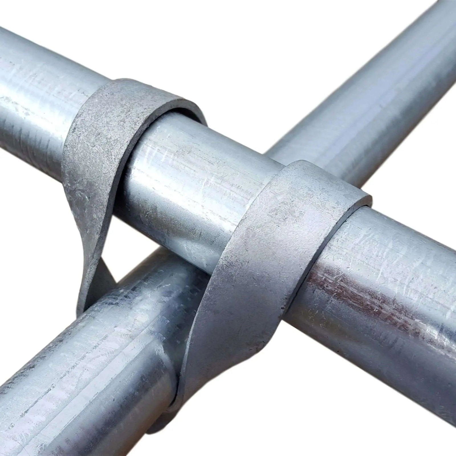 Close-up photograph showing galvanized steel pipe joints with textured metal bands exhibiting a matte finish and subtle metallic sheen
