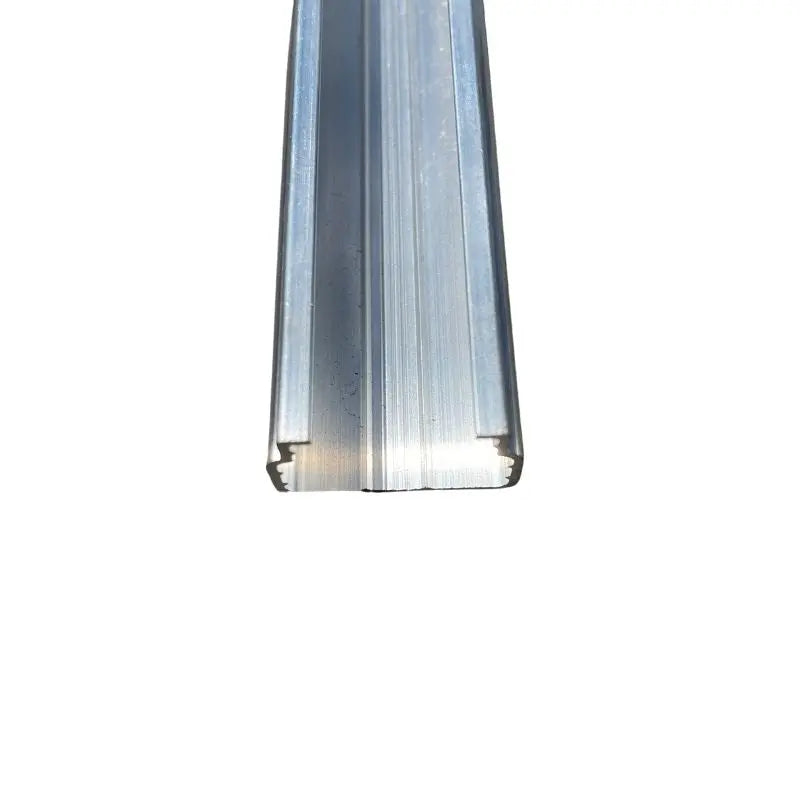 Aluminum extrusion profile showing a sleek silver finish and a U-shaped channel with subtle linear textures and milled edges

