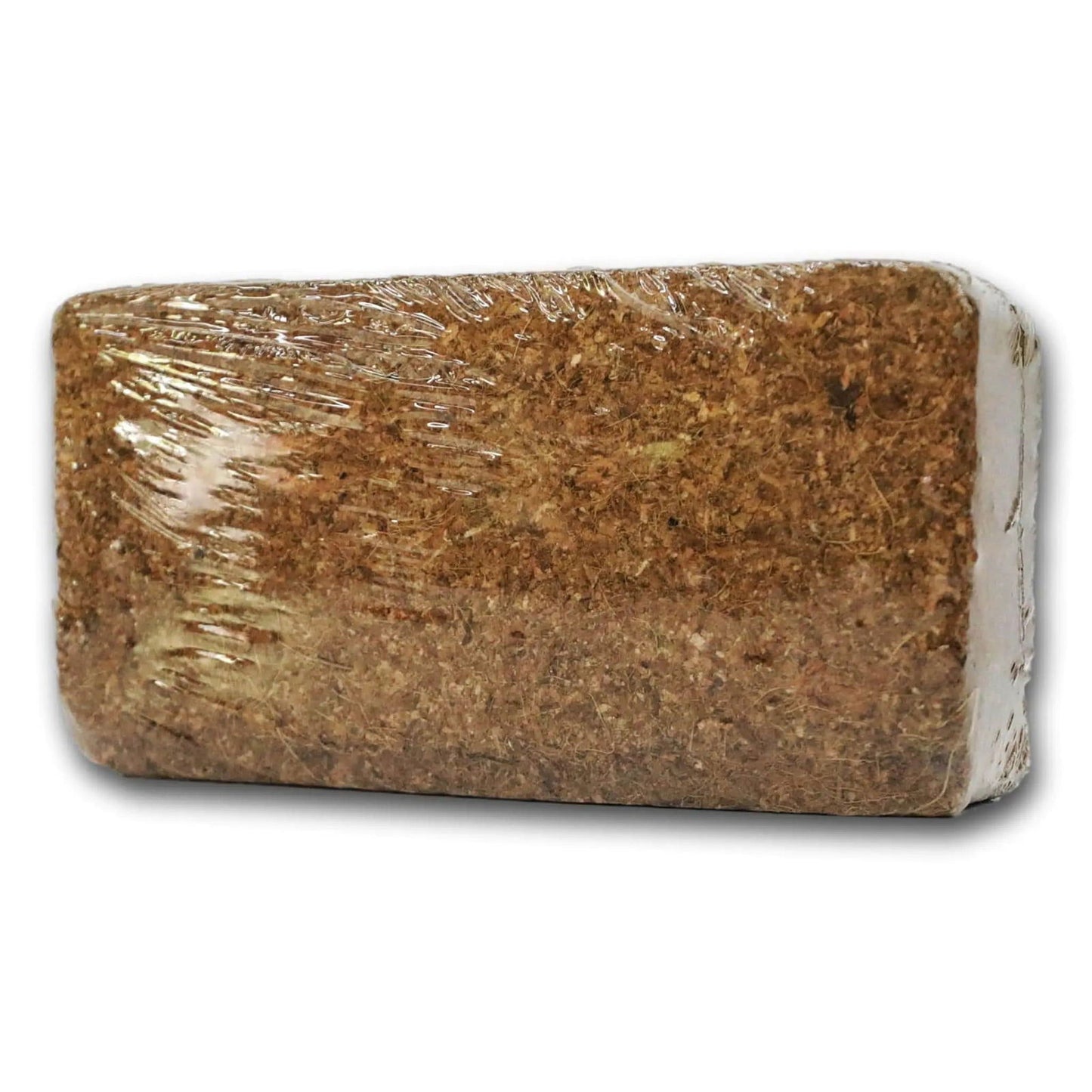 Compressed coconut coir brick showing fibrous texture and brown hues wrapped in clear plastic ready for planting.
