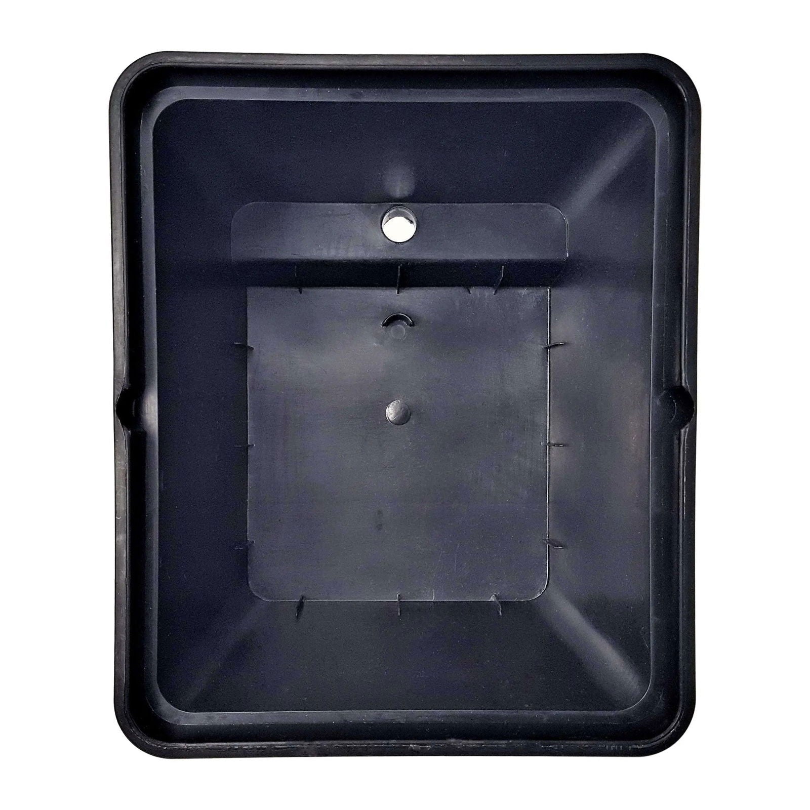 Plastic tray showing a dark gray interior with a central hole and molded details along its edges