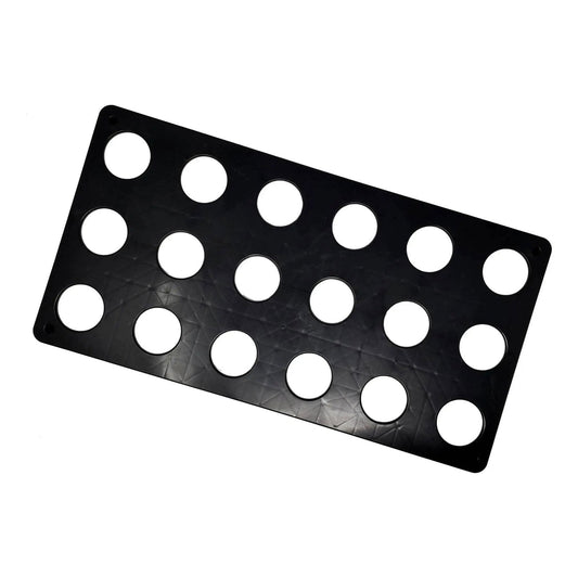 Black plastic sheet with sixteen circular cutouts and a textured geometric pattern showcasing a minimalist design
