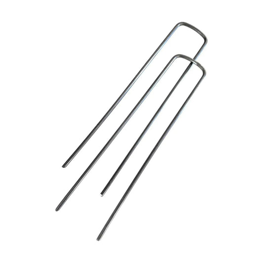 Product shot of three metallic U-shaped landscape staples against a white background showing their simple design and slightly reflective surface