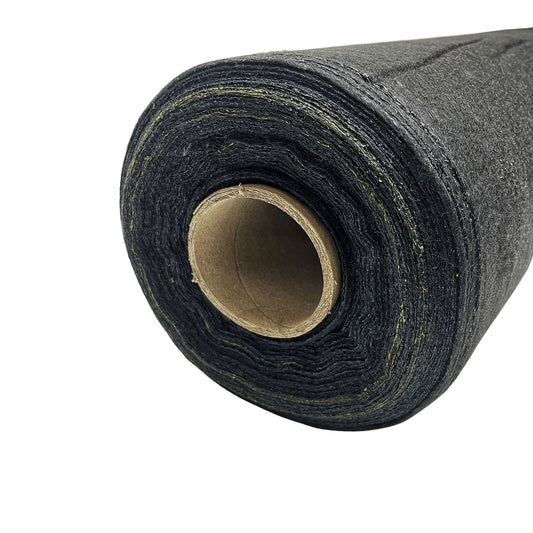 Close-up of a roll of dark gray landscape fabric showing a cardboard core and subtle hints of lime green thread throughout