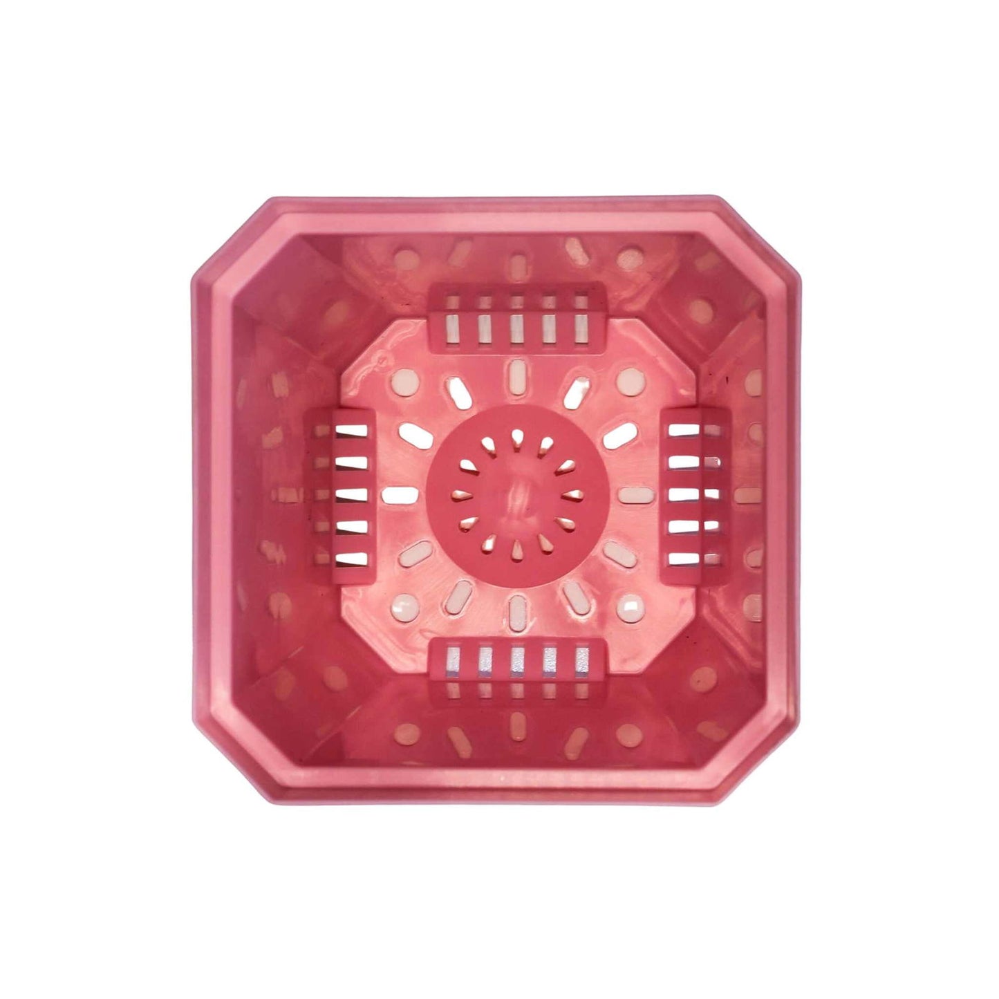 A top-down view of a pink, octagonal Bootstrap Farmer 5" Heavy Duty Seed Starting Pot with multiple holes and slits for drainage or ventilation, perfect for starting seeds. The background is white.