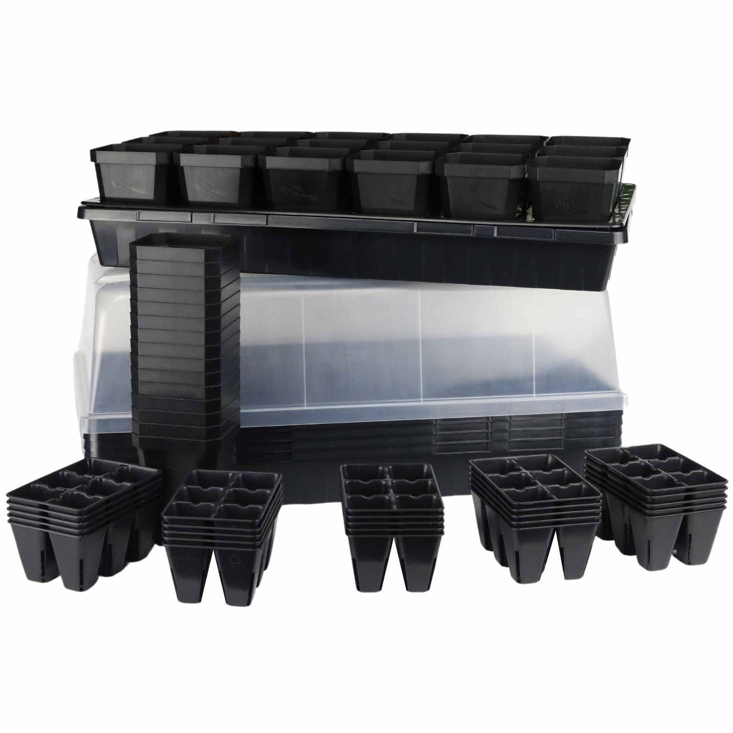 Plastic seedling starter kit with multiple black seed trays a clear plastic dome and stacks of individual cells showing leaf-shaped logos and textured bases
