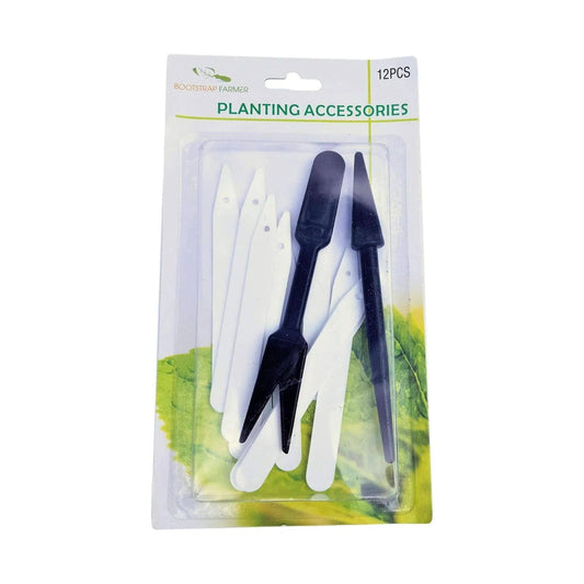 The Bootstrap Farmer Widger Dibber Set includes 12 planting accessories—plant labels and two black tools—perfect for seedling transplantation, all attractively displayed on a green leaf background.